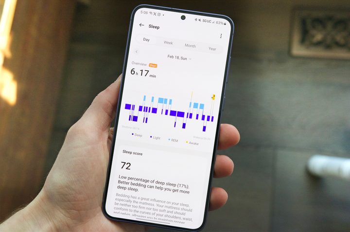 Someone holding an Android phone with the OHealth app open, showing sleep tracking stats for the OnePlus Watch 2.