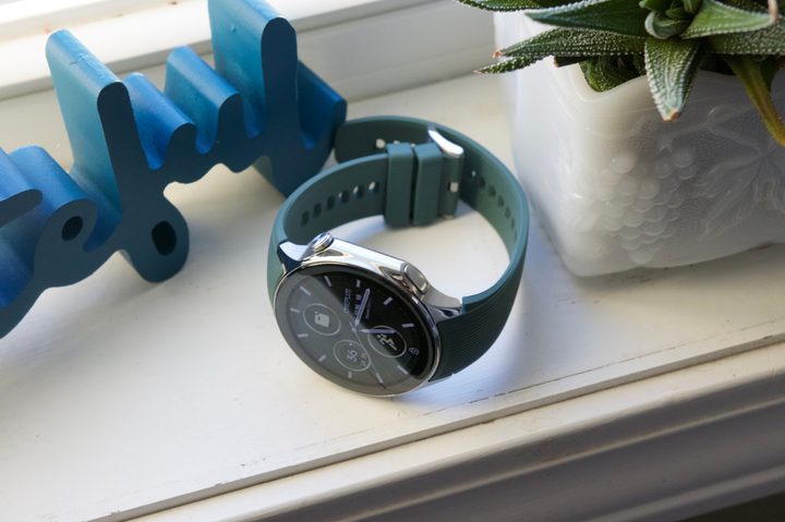 The OnePlus Watch 2 sitting on a window sill.
