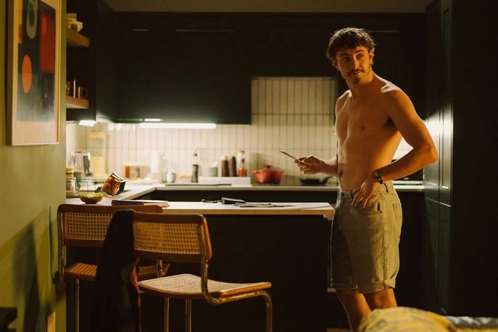 Paul Mescal stands in a kitchen in All of Us Strangers.