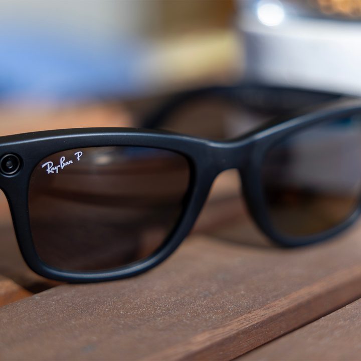 A pair of Ray-Ban Meta smart glasses on a table.