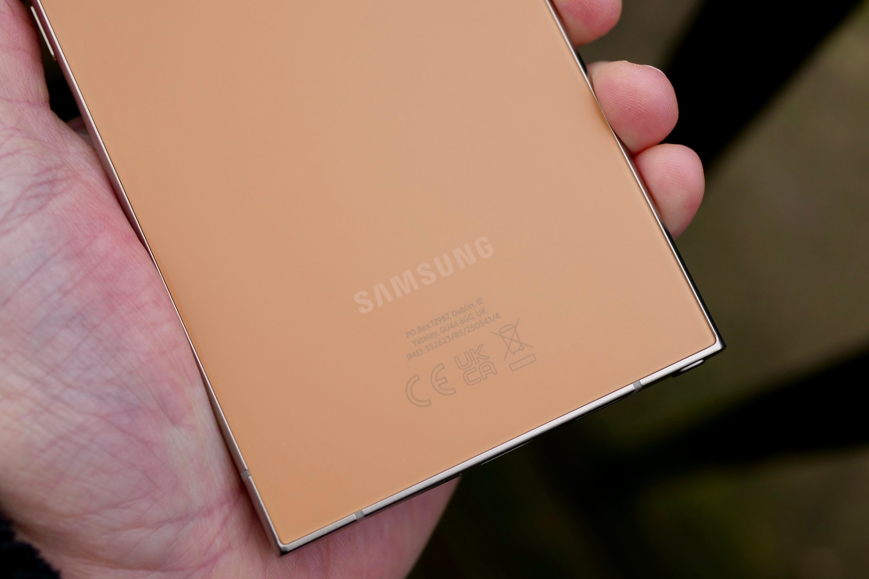 The logos stamped on the Samsung Galaxy S24 Ultra in Titanium Orange.