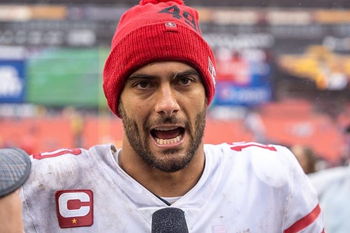 Jimmy Garoppolo talks to reporters.