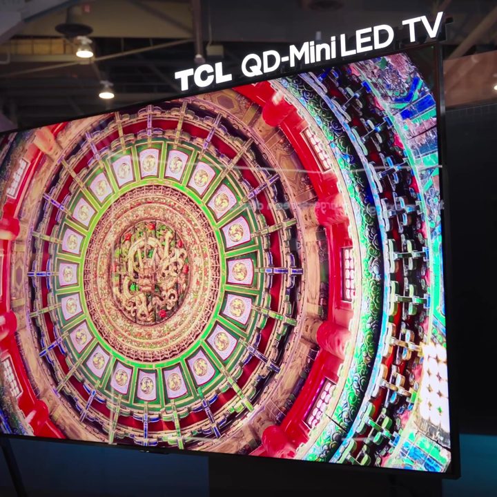 A brightly colored mandala shown on a TCL qm89 TV.