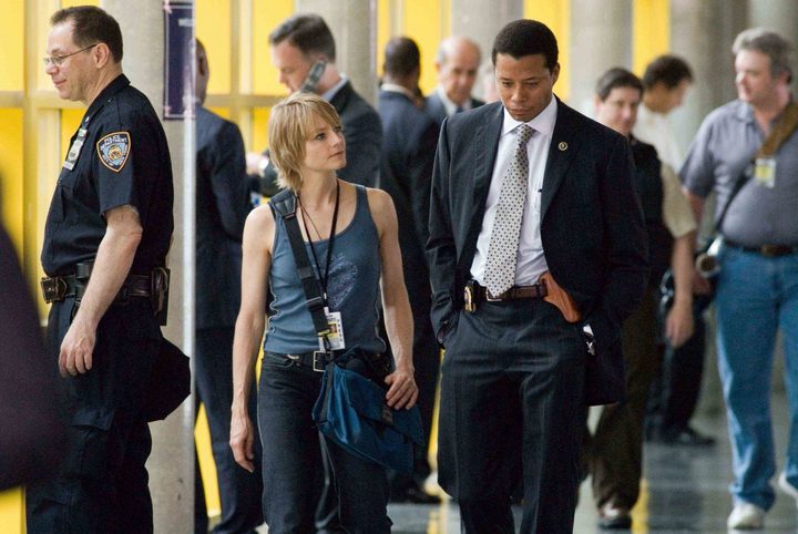 A woman speaks to a detective in The Brave One.