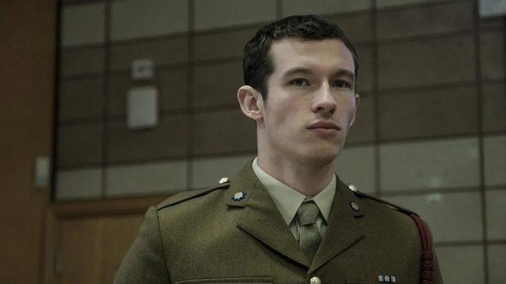 A young man in a military uniform in a scene from The Capture.