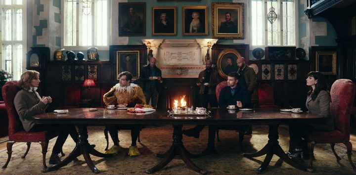 4 people sit at a long table in The Gentleman.