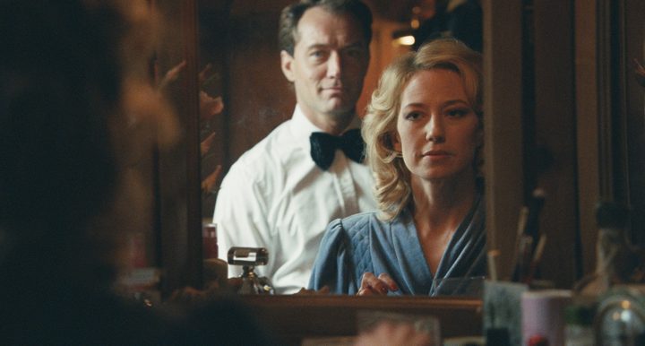 A man stands behind a woman in The Nest.