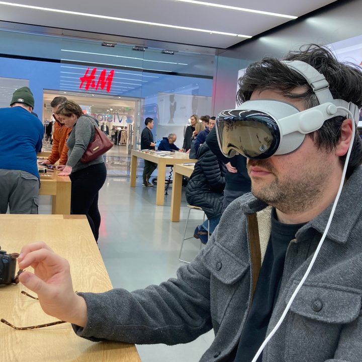 Someone using a Vision Pro demo at an Apple Store.