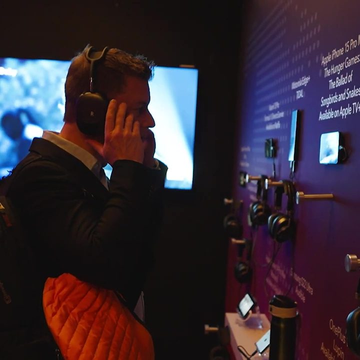A man interacting with a display a the Dolby Atmos FlexConnect showcase at CES.