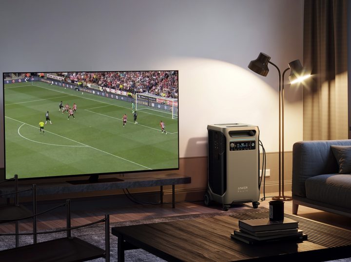 Anker SOLIX F3800 portable power station used in living room to power lights and TV.