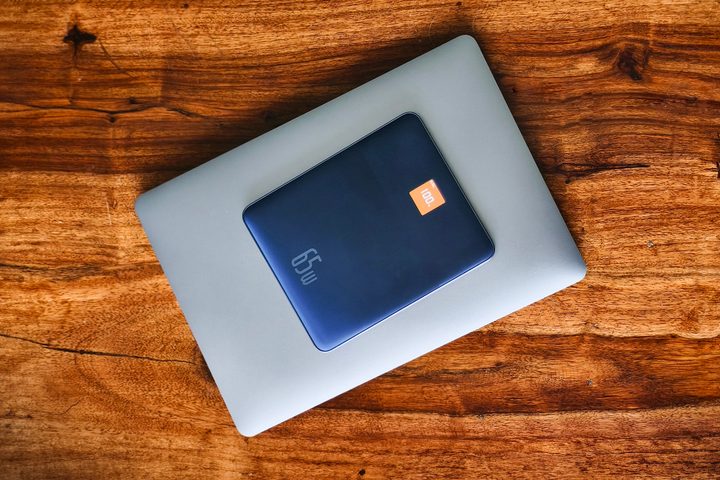 Baseus Blade 2 65W fast charging power bank for laptops kept on a 13-inch MacBook Pro 2020.