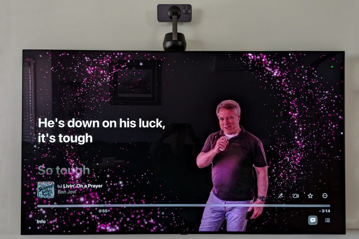 Belkin Stand Pro mounted on top of Apple TV with Apple Music Sing Karaoke.