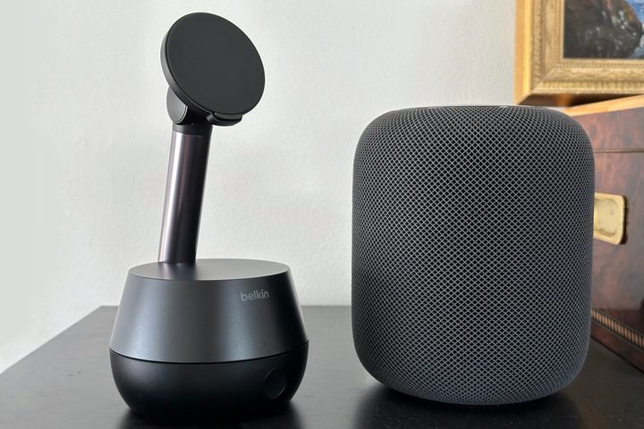 Belkin Stand Pro next to HomePod speaker.