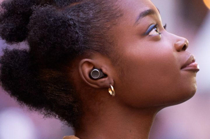 Woman wearing Cambridge Audio Melomania M100.