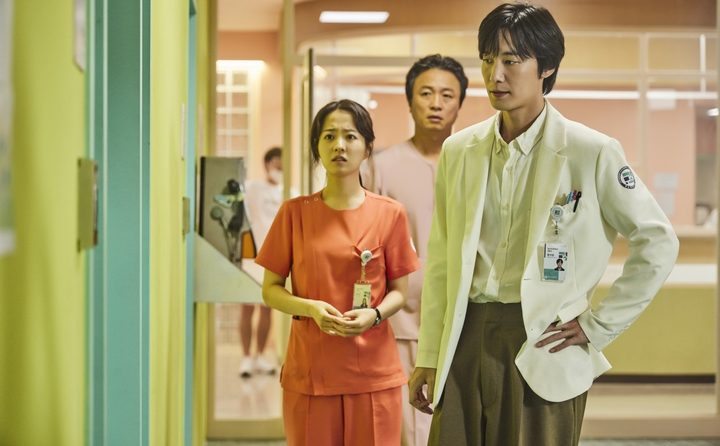 Three hospital workers look concerned in Daily Dose of Sunshine.