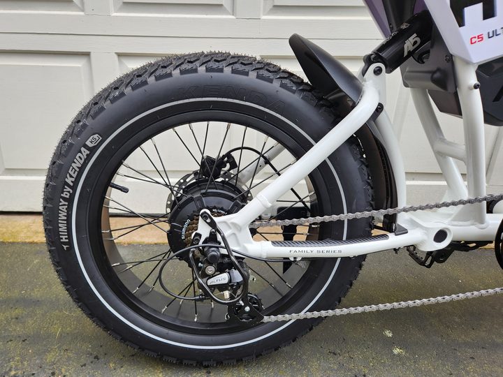 Himiway C5 e-bike right rear view of the hub motor, derailleur and gear cassette, Himiway by Kendra rear tire with half fender, and the air shock below the seat.