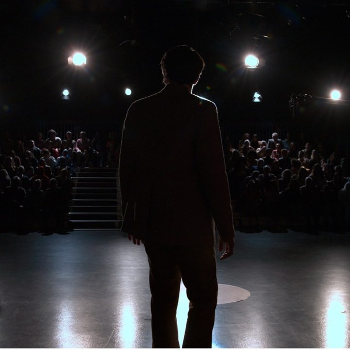 David Dastmalchian faces his talk-show audience in a still from Late Night with the Devil