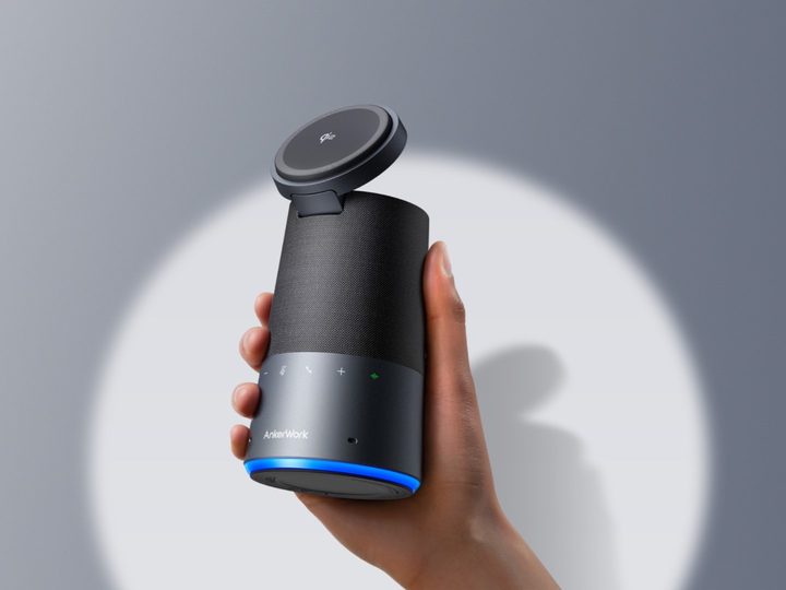 User holding up AnkerWork S600 speakerphone