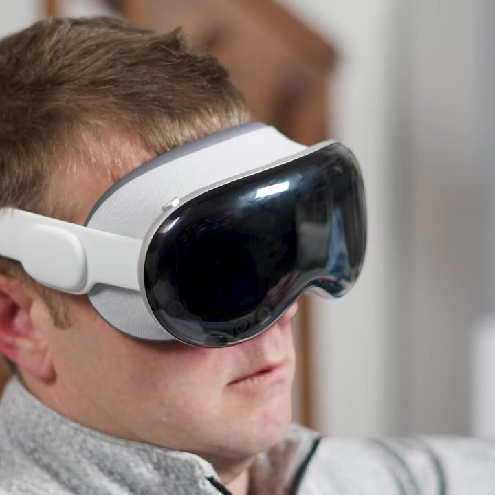 A man wears an Apple Vision Pro headset.