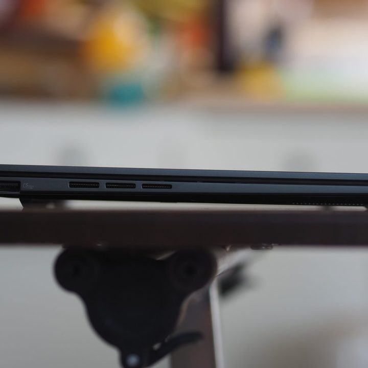 Asus Zenbook 14 Q425 left side view showing ports and vents.