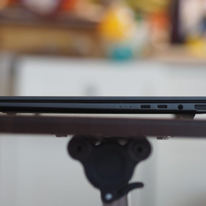Asus Zenbook 14 Q425 right side view showing ports and vents.
