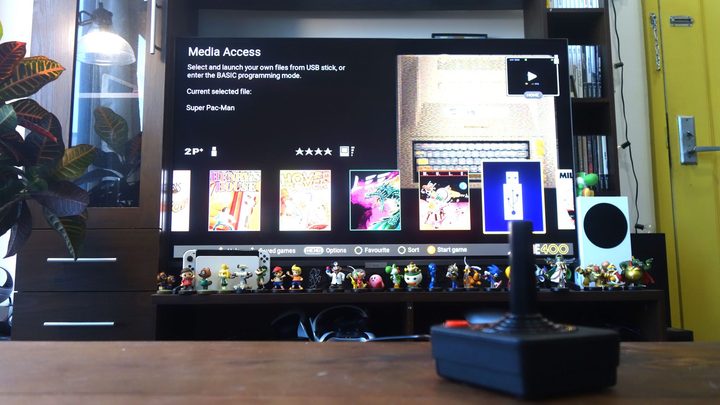 An TV shows the Atari 400 Mini's media library.