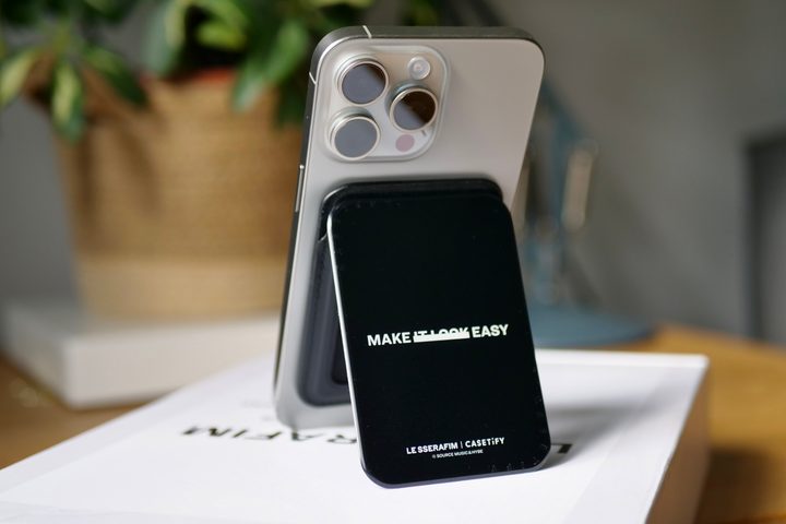 The Casetify x Le Sserafim Card Holder accessory on an iPhone 15 Pro Max.