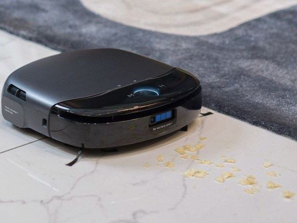 eufy Omni S1 Pro robot vacuum and mop cleaning a mess on the floor