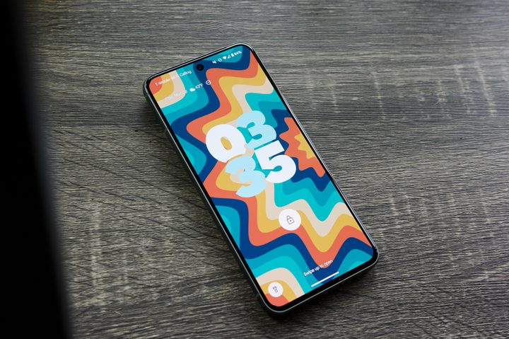 The Google Pixel 8 with its display on, showing the lock screen.