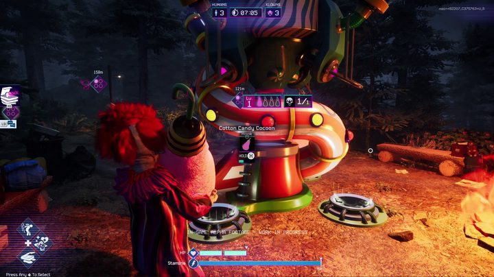 A klown is carrying a large cocoon of cottton candy to put into a machine in Killer Klowns from Outer Space
