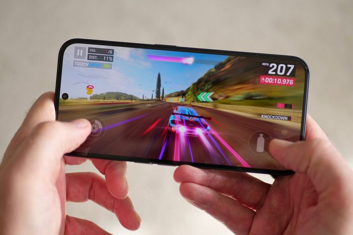 A person playing a game on the Nothing Phone 2a.