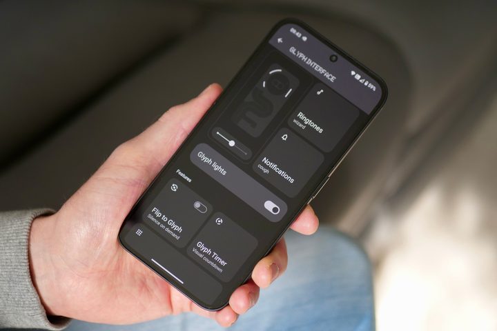 A person holding the Nothing Phone 2a, showing the Glyph Light menu.