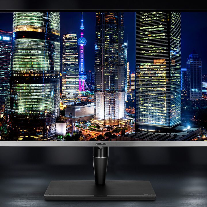 The ProArt Mini-LED monitor on a grey table.