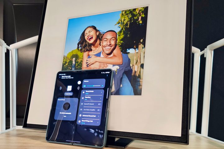 Samsung Music Frame with Samsung Galaxy Z Fold phone showing SmartThings app.