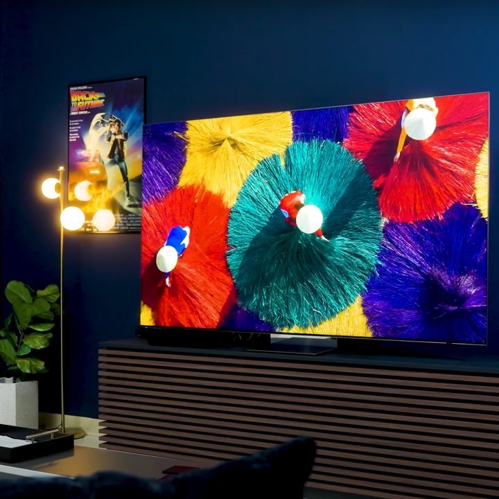 Brilliantly colored traditional dress costumes seen in an arial view displayed on a Samsung QN900D TV.