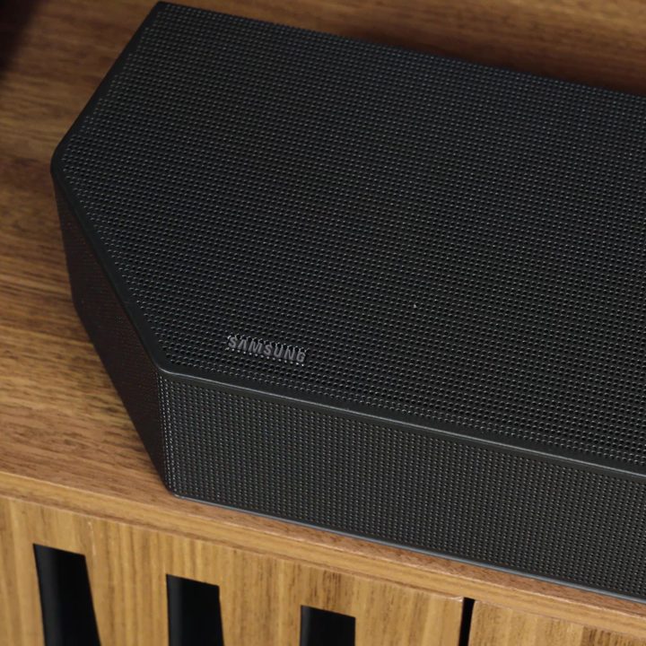A close up of a Samsung Q990C soundbar on a media console.