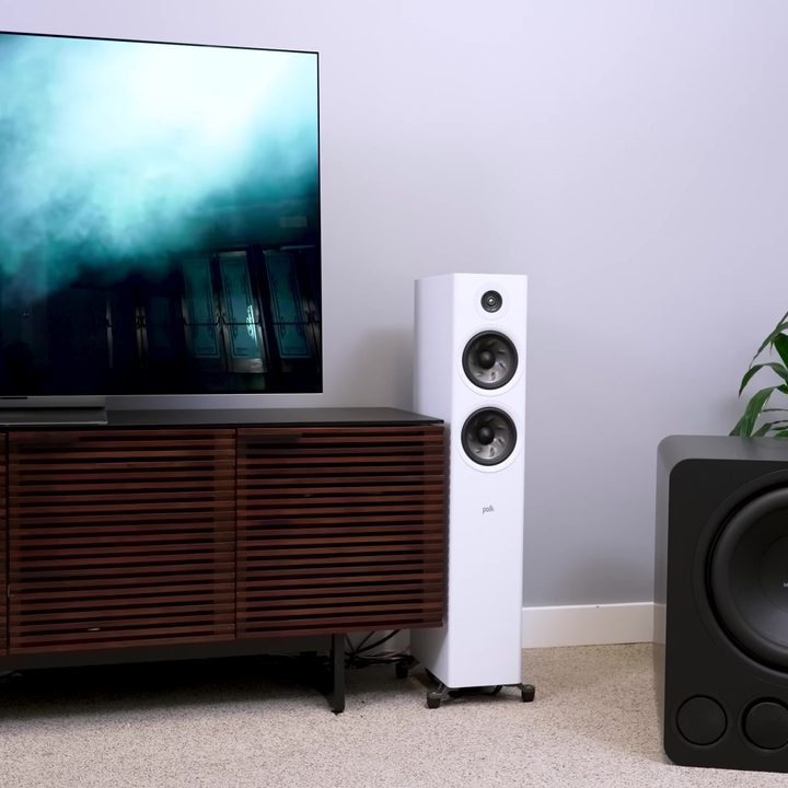 A subwoofer in a corner of a media room.