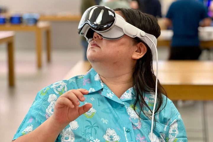 A person wearing the Apple Vision Pro demo unit in an Apple Store.
