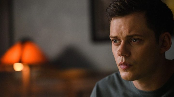 Bill Skarsgård as Kane looking intently at something off-camera in Nine Days.