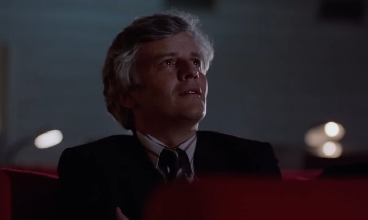 Salvatore in a movie theater in "Cinema Paradiso."