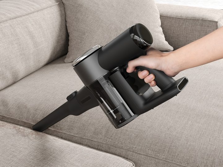 A person using the cordless vacuum of the X2 Combo.