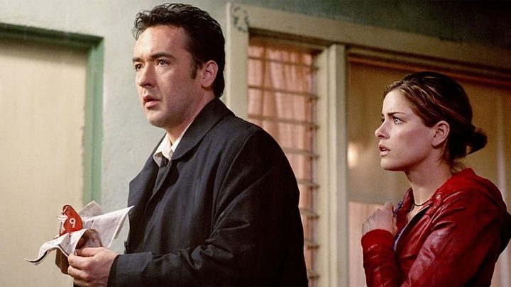 John Cusack and Amanda Peet in Identity.