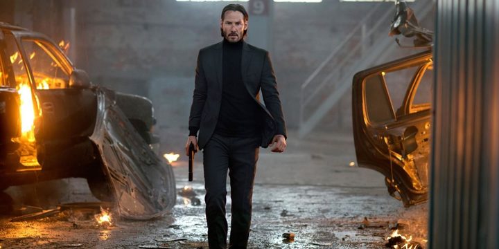 John Wick walks with his gun