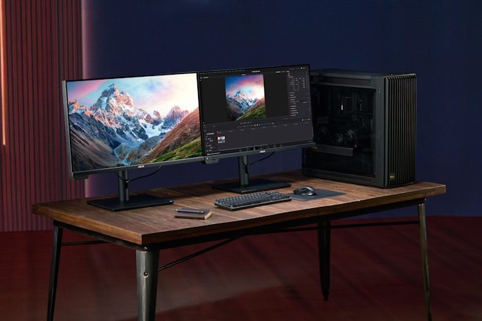 The Asus ProArt PA32KCX 8K mini-LED professional monitors placed next to each other on a desk.