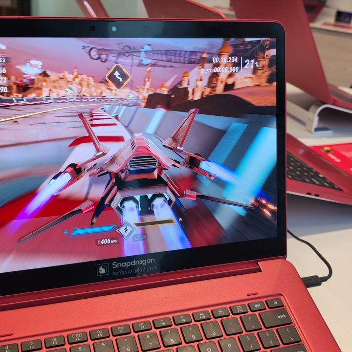 A racing game running on a Qualcomm Snapdragon X Elite reference laptop.