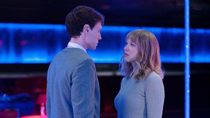 George MacKay and Léa Seydoux stare at each other in a still from The Beast