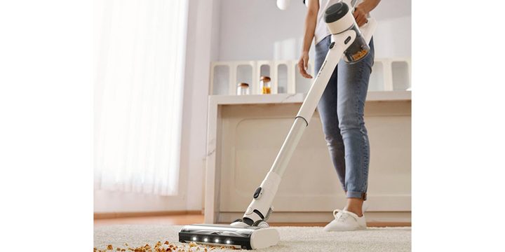 Someone using the Tineco Pure One X Dual Smart Cordless Stick Vacuum.