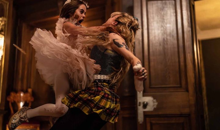 A little girl attacks a woman in Abigail.