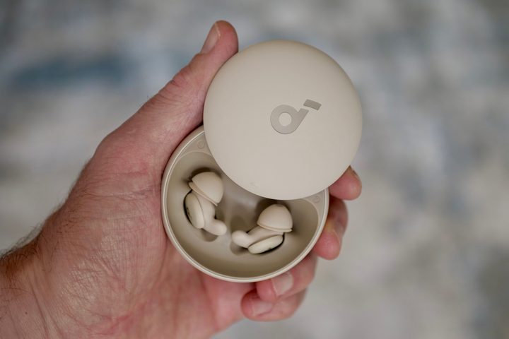 A person holding the Anker Soundcore Sleep A20's open case.
