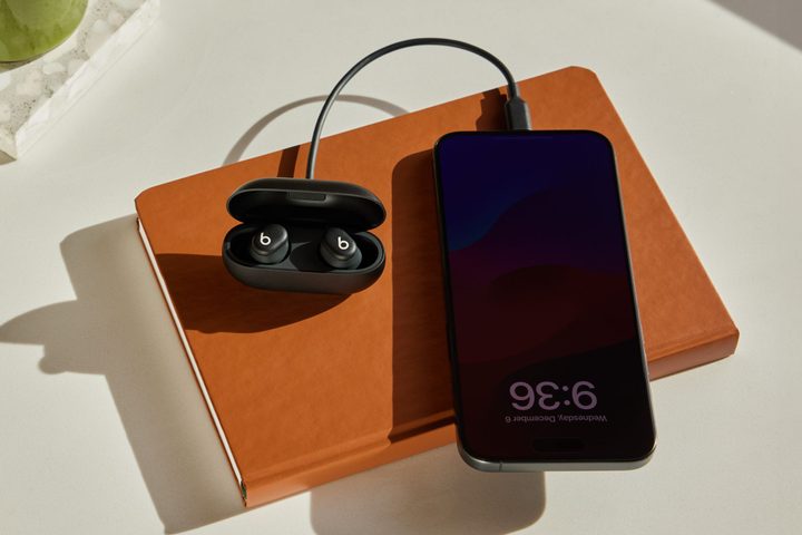 Beats Solo Buds connected to an iPhone 15 via USB-C.